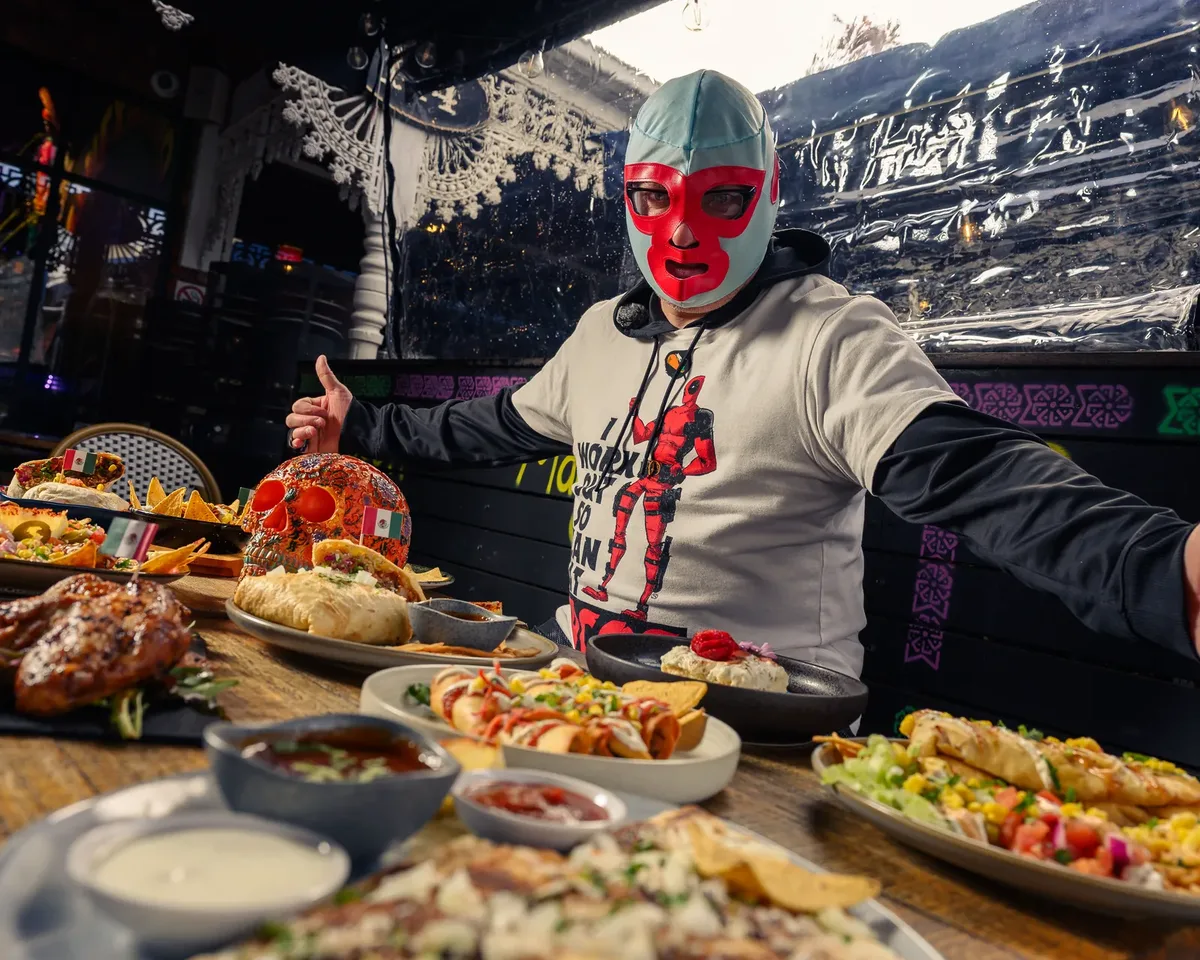 Luchador with Jarritos, fiesta at El Mexicano